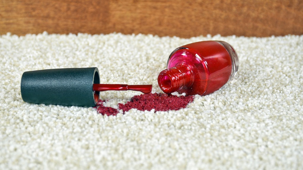 Spilled red nail polish on carpet picture id607507544